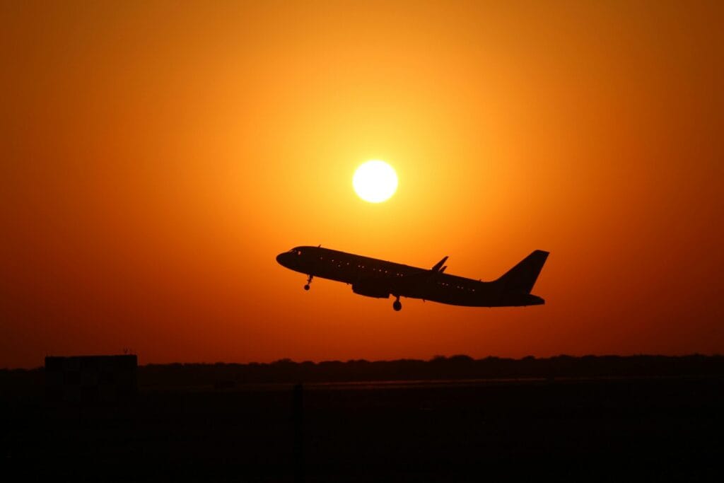 Airplane silhouette at sunset