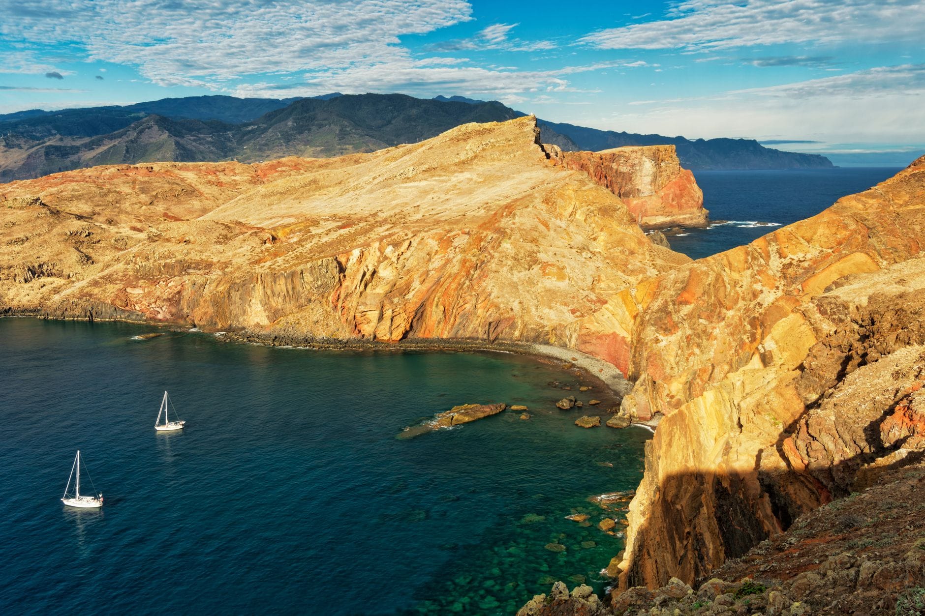 aerial photography of mountains near ocean