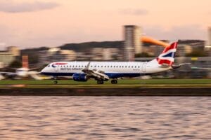 Flying with British Airways - aircraft on final approach at sunset