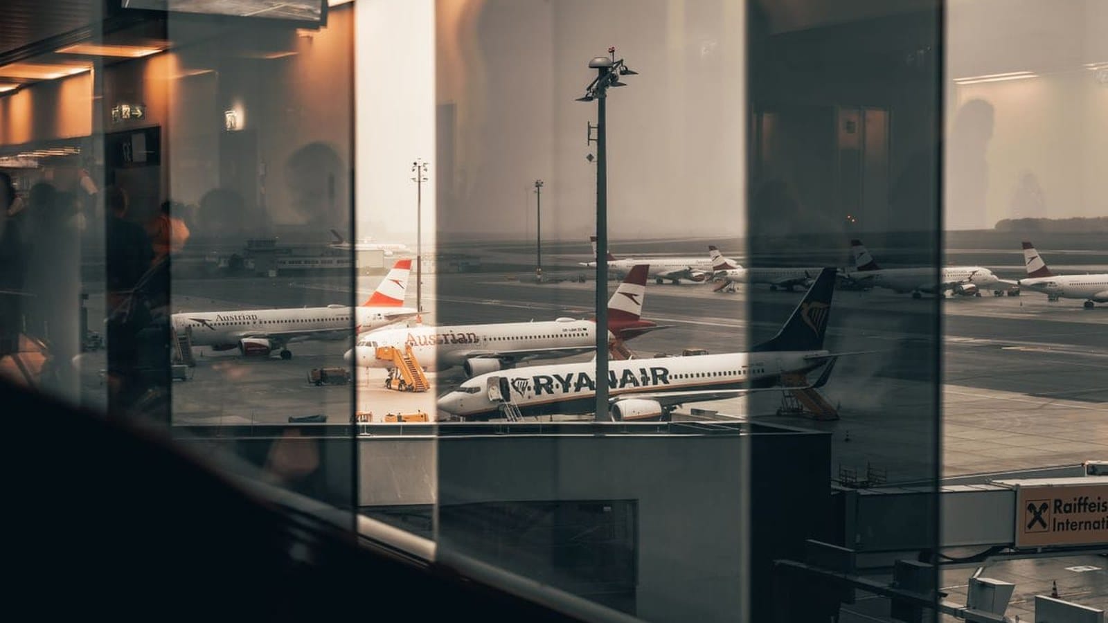 Passenger aircraft parked at an airport terminal for a cheap flight sale