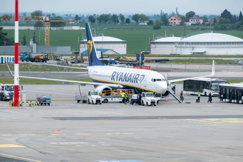 Ryanair aircraft at departure terminal — flying with Ryanair from a UK airport