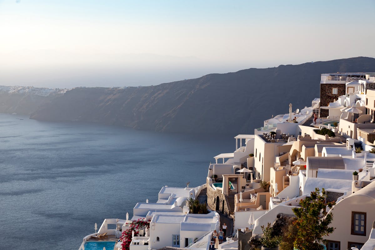 Caldera-edge white houses and calm Aegean Sea at Imerovigli, Santorini