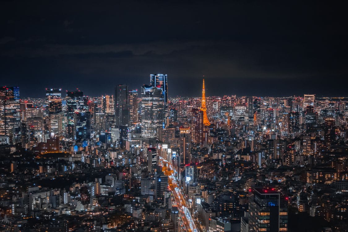 tokyo budget travel — Tokyo skyline at night with Tokyo Tower illuminated