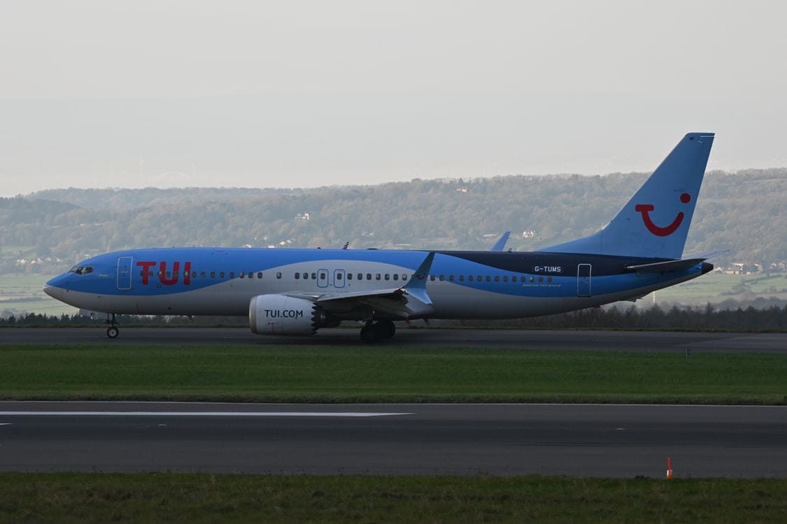 TUI aircraft with TUI.com branding on the runway at Bristol Airport, United Kingdom