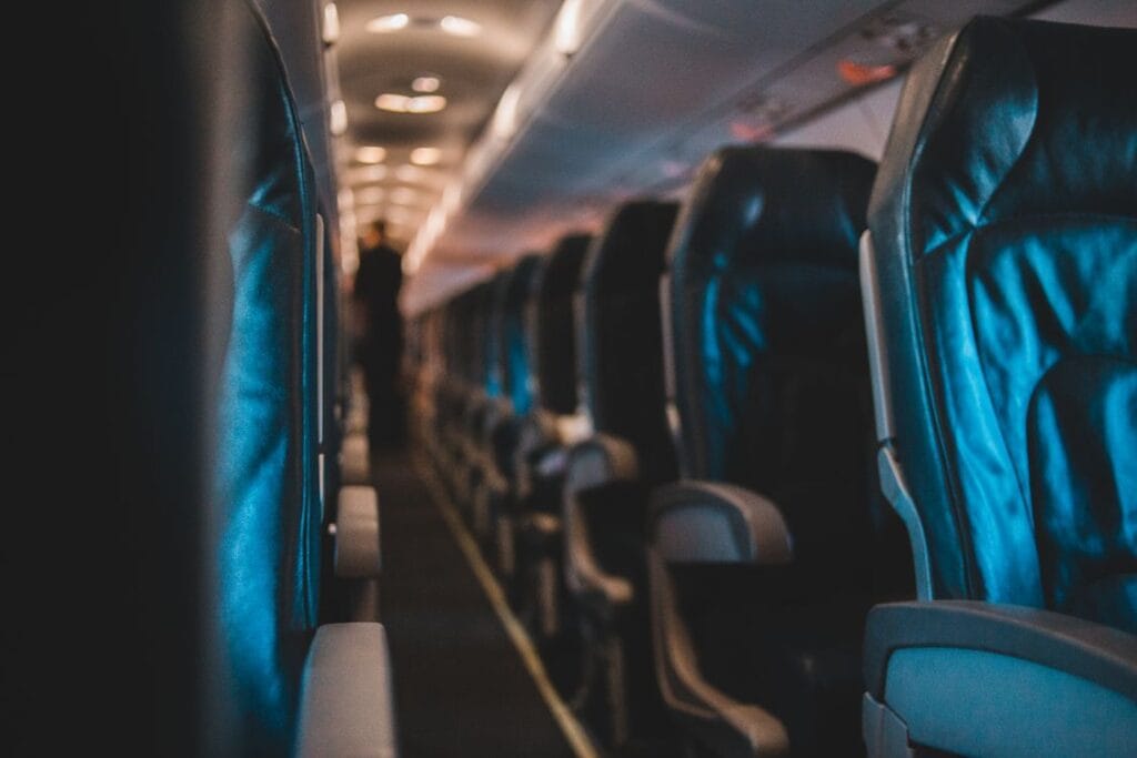 TUI seat selection — empty airplane cabin interior with leather seats