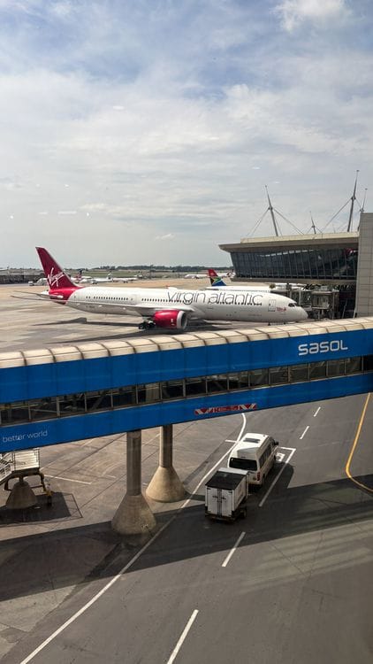 Virgin Atlantic aircraft parked at an airport terminal ready for boarding