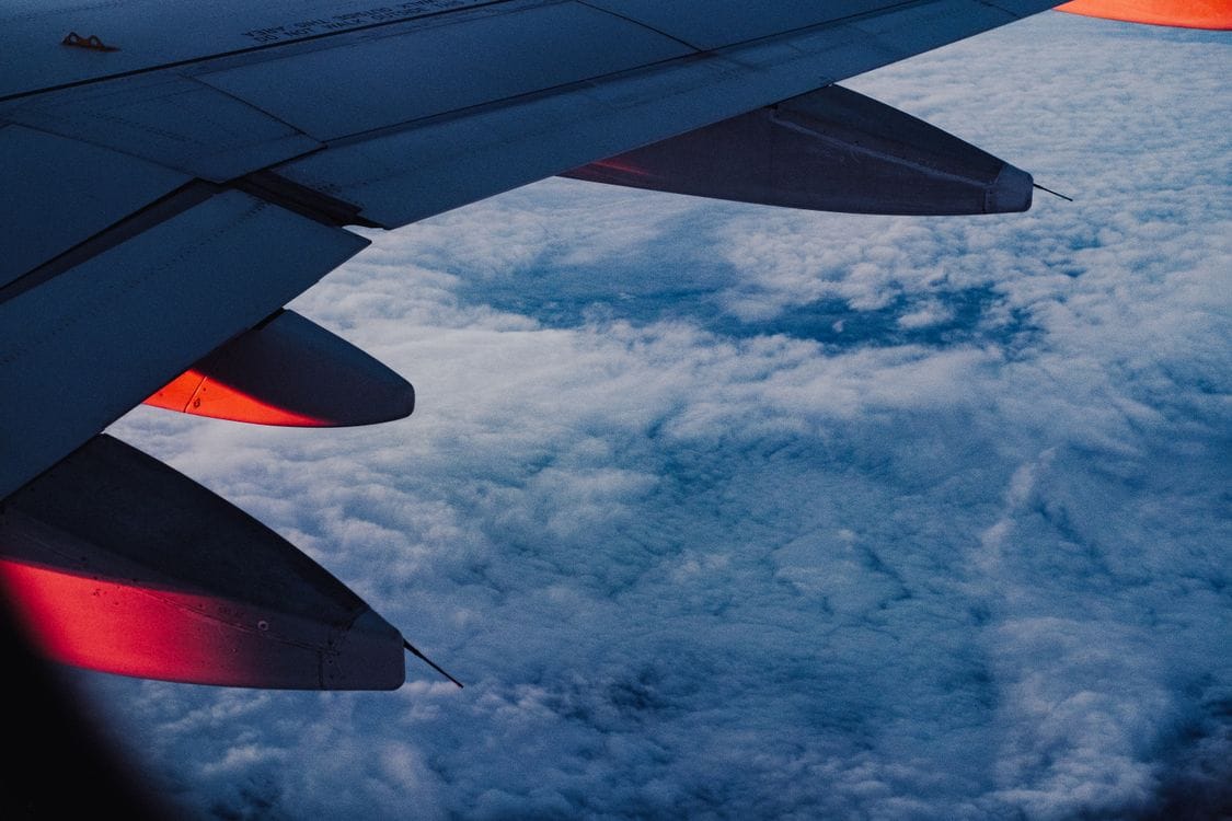 Aer Lingus sale dates: aircraft wing over clouds at twilight