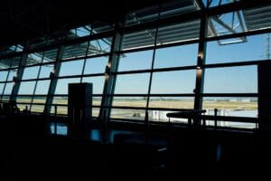 Best carry on bag for Aer Lingus — airport terminal window overlooking the runway
