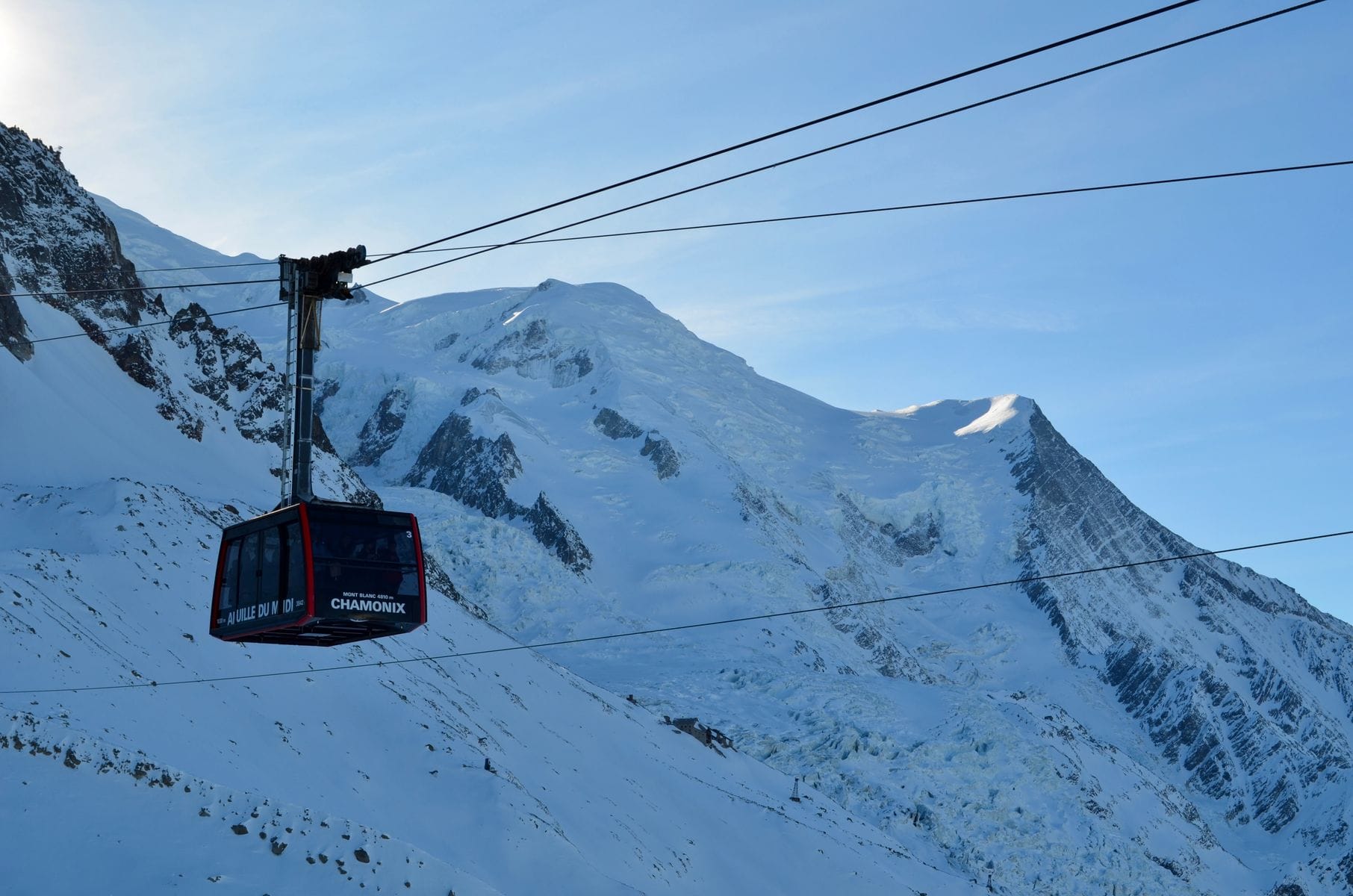 The Aiguille du Midi cable car climbing towards Mont Blanc above Chamonix