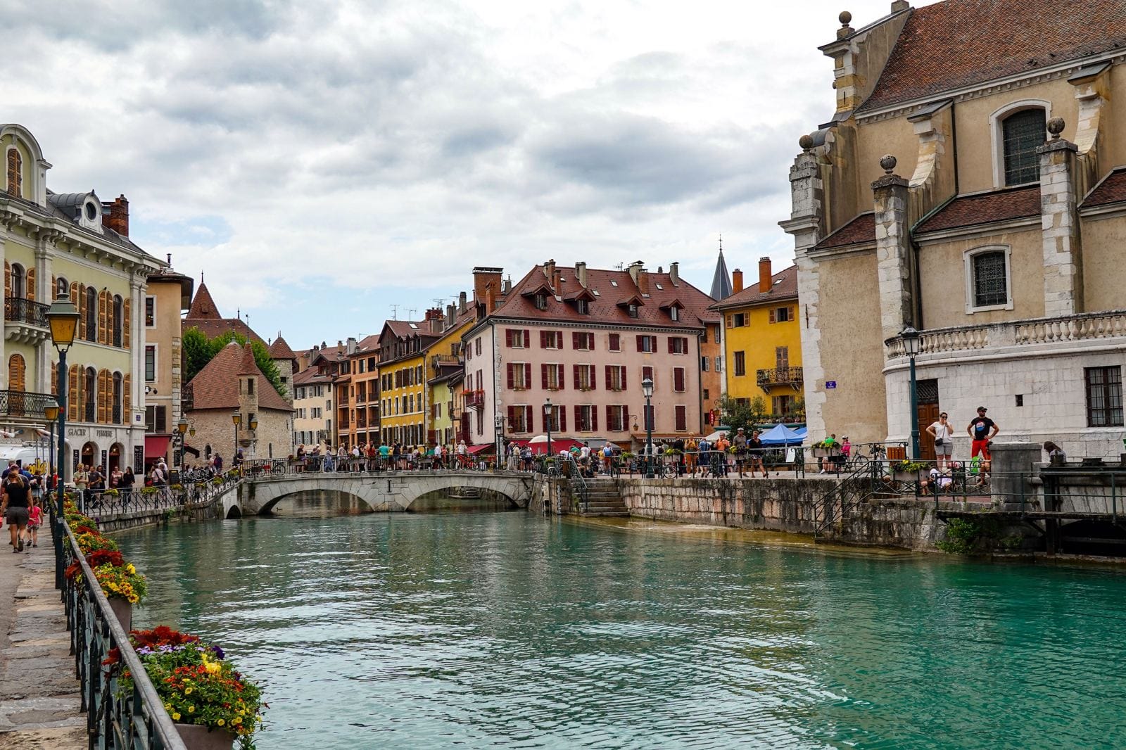 Colourful old town buildings and bridges along the canal in Annecy, France