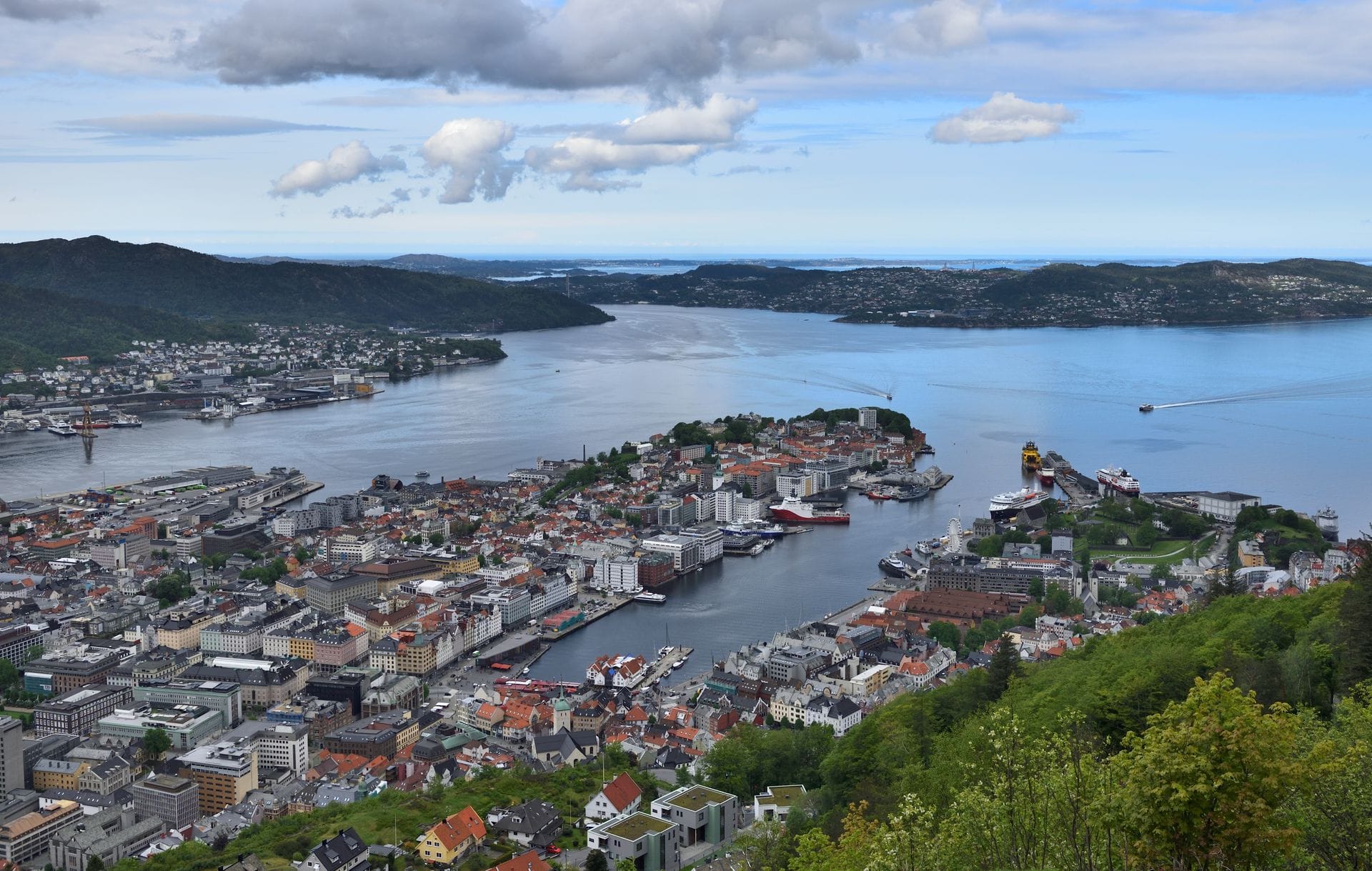 Aerial view of Bergen's colourful waterfront and coastal cityscape in Norway