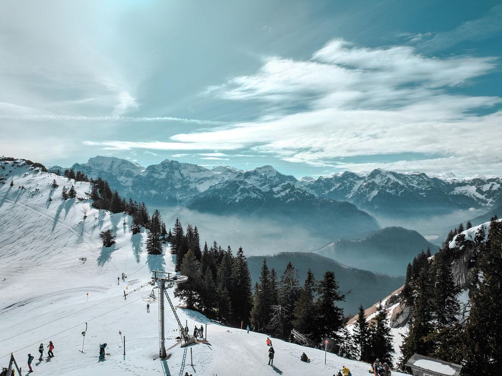 Skiers on a snowy slope in the Alps, one of the ski destinations British Airways Holidays packages