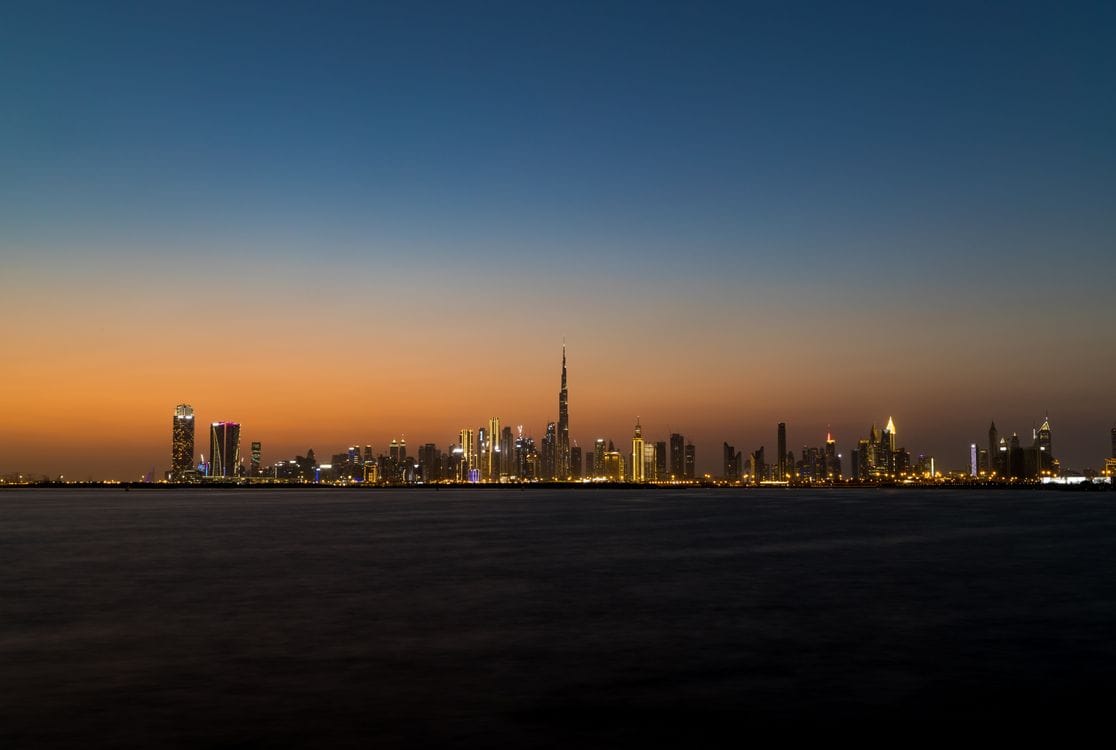 Dubai's skyline at dusk with the Burj Khalifa lit up, one of British Airways Holidays' Middle East destinations