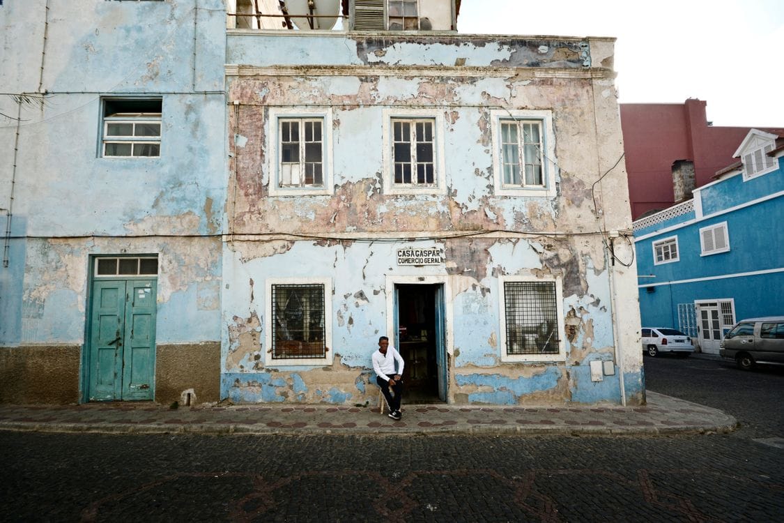 A weathered colonial-era building on a street in Mindelo, Cape Verde