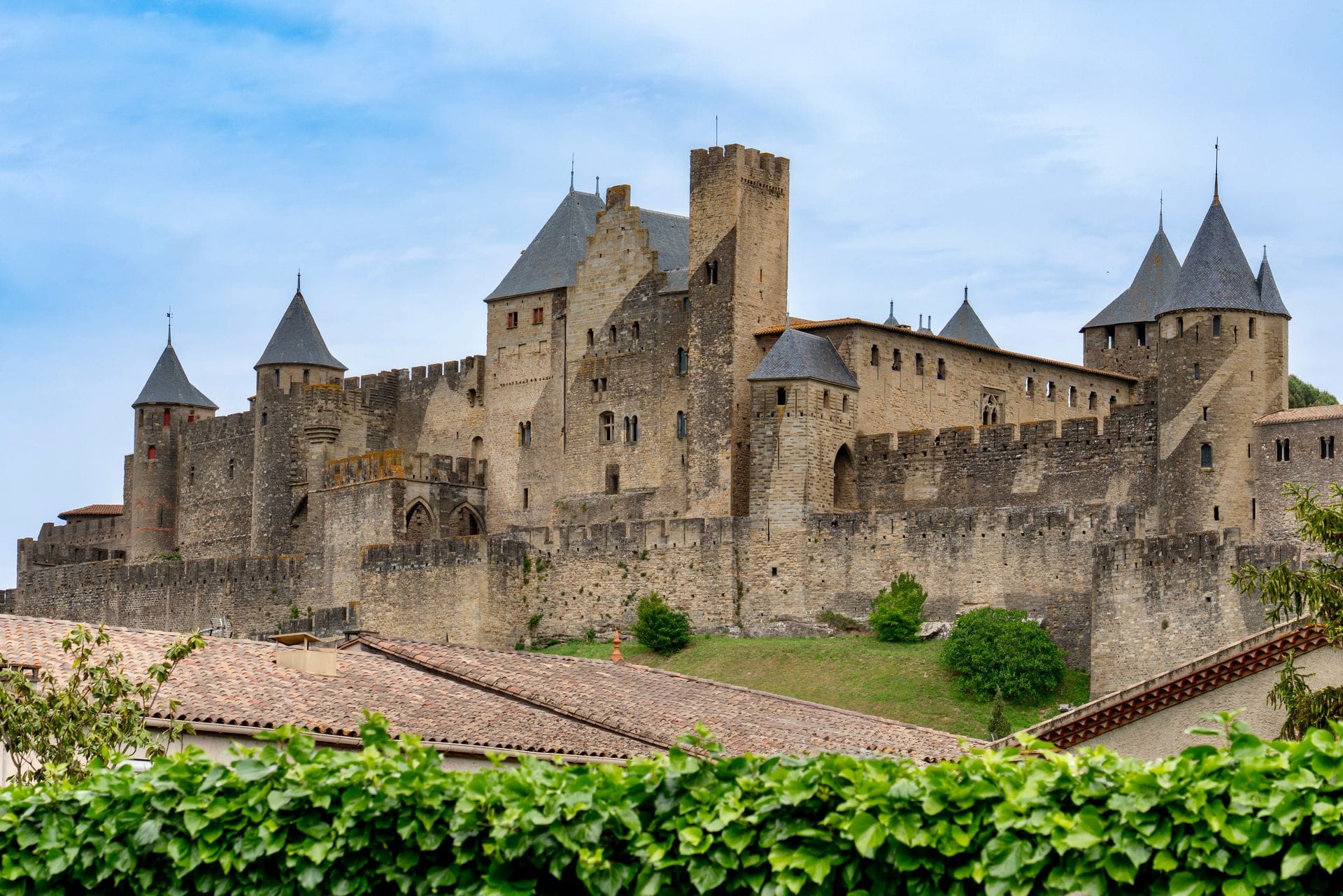 Carcassonne's Chateau Comtal surrounded by spring greenery