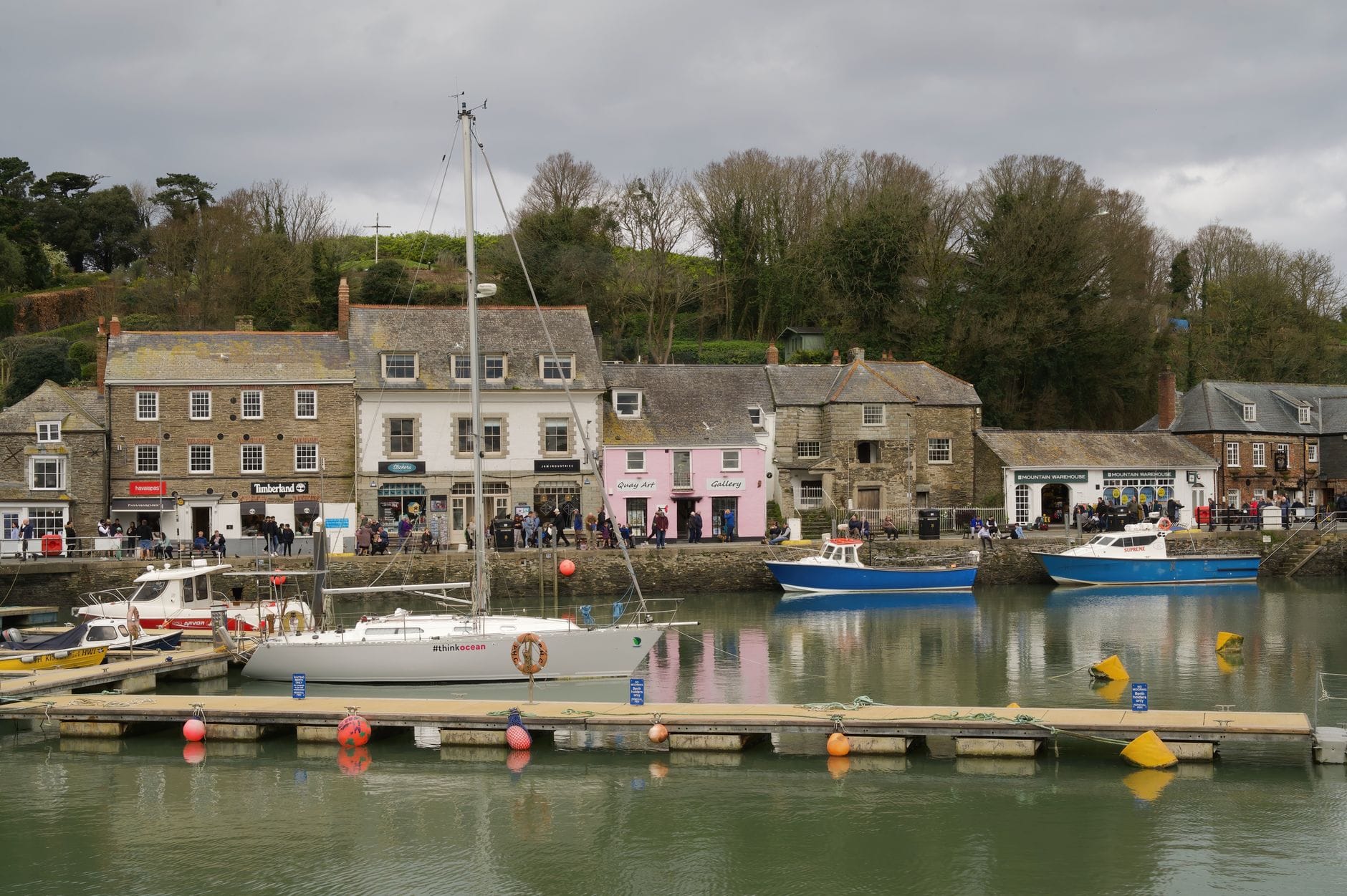 Padstow harbour with fishing boats and pastel-coloured buildings, Cornwall