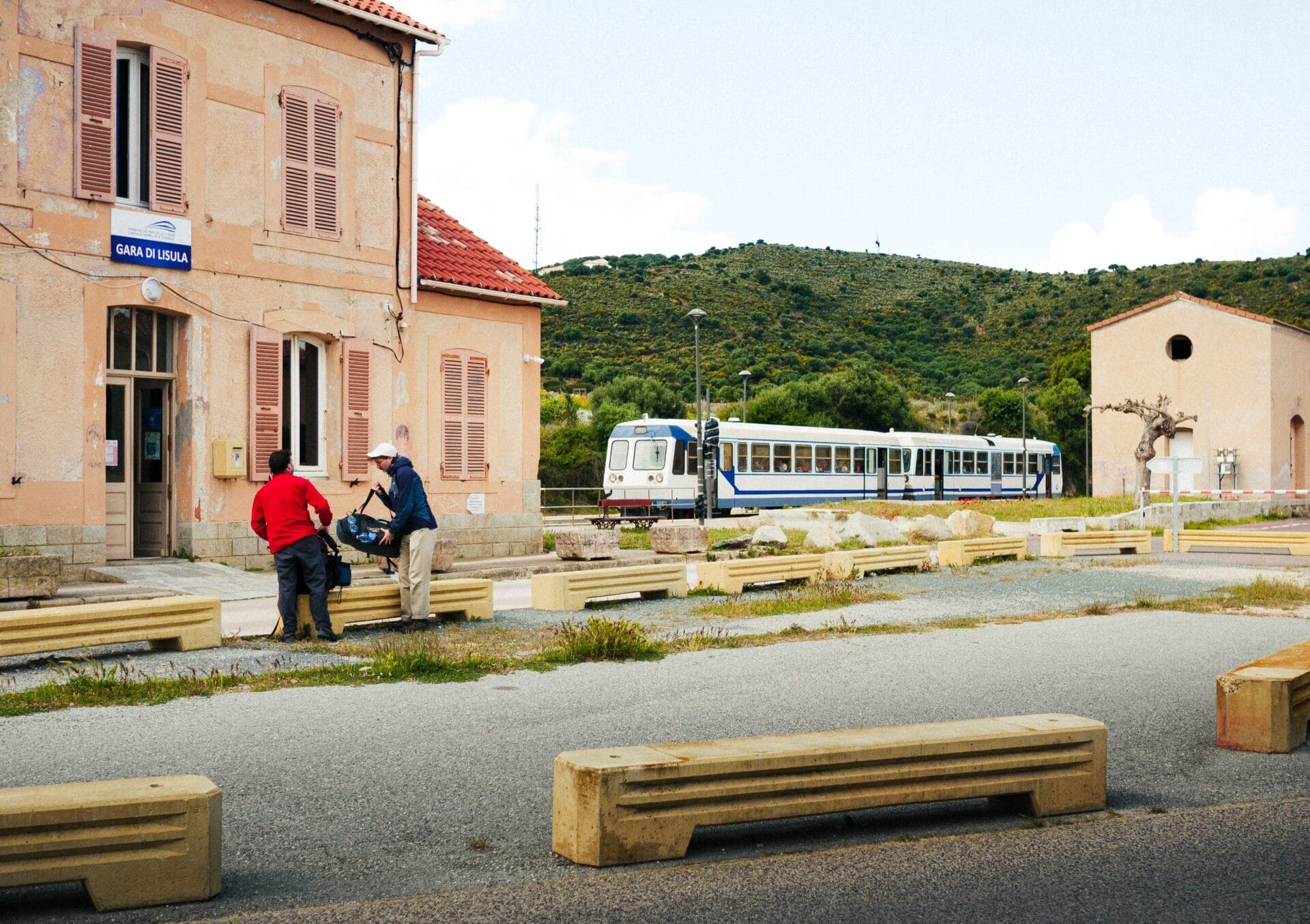 A train at a station on Corsica's mountain railway line between Ajaccio and Bastia