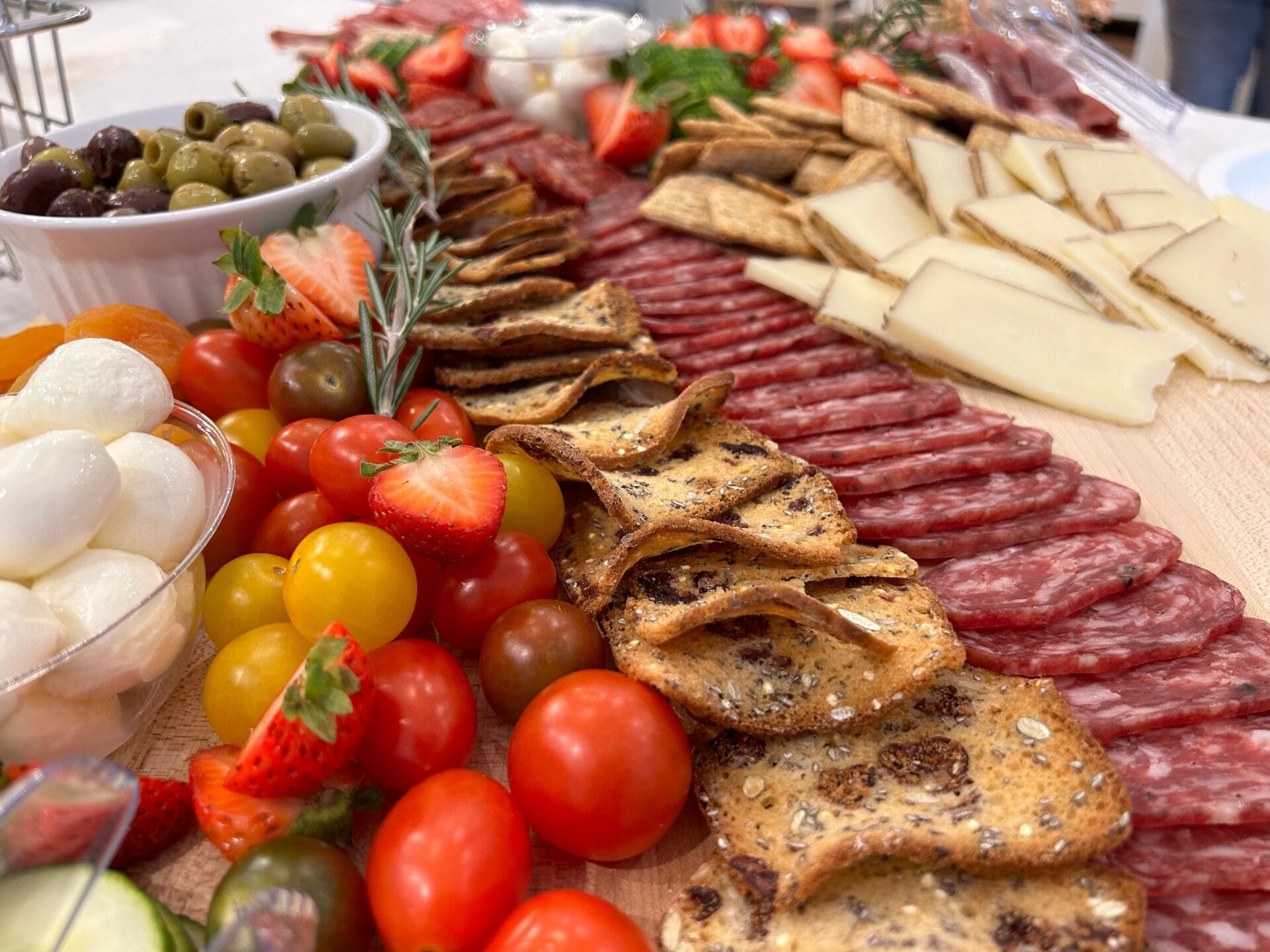 A Corsican charcuterie board with cured meats and brocciu cheese