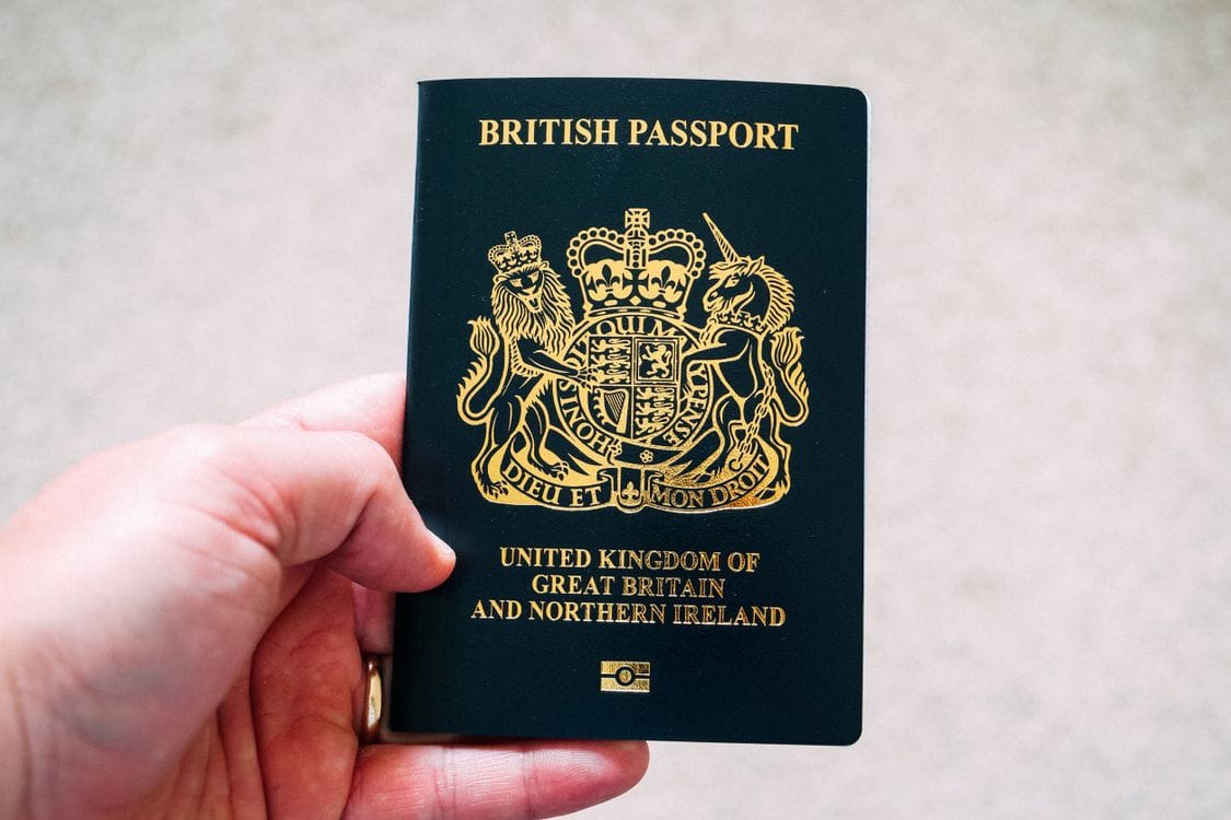 A British passport held in hand, the document needed to apply for Global Entry as a UK citizen