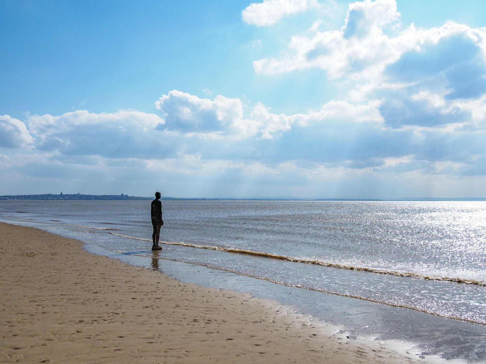 One of the cast-iron figures from Antony Gormley's Another Place on Crosby Beach, Liverpool