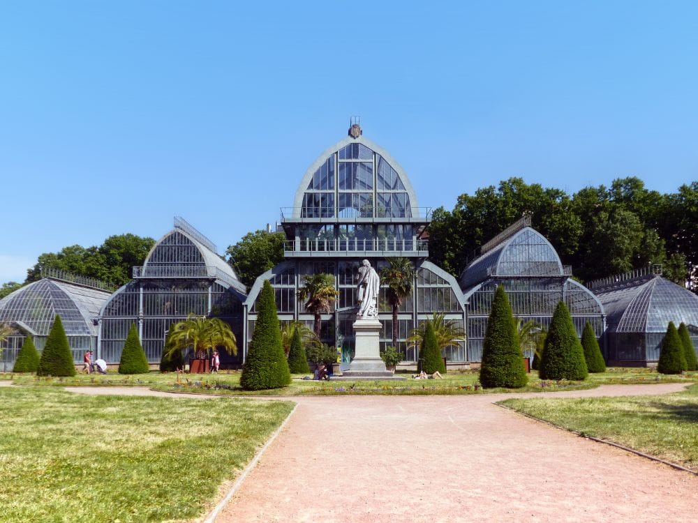 Glasshouses and greenery in the botanical garden at Parc de la Tete d'Or, Lyon