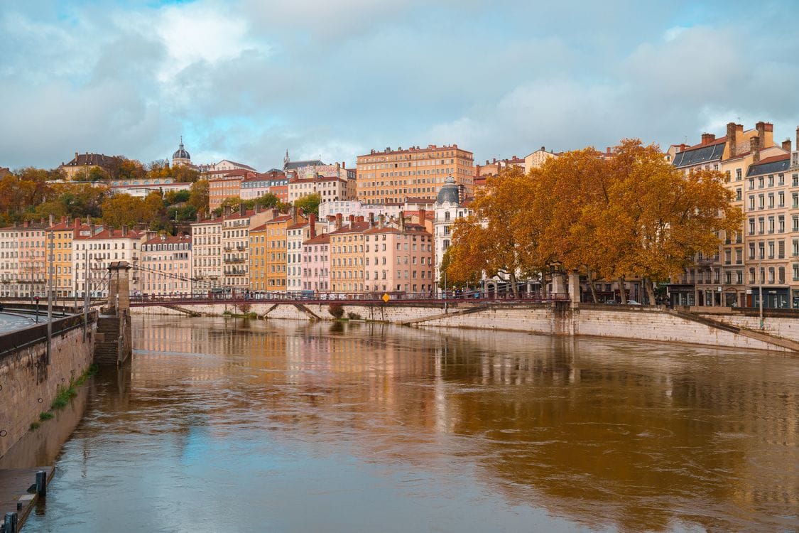 The Saone River winding through Lyon's historic riverside buildings in autumn light