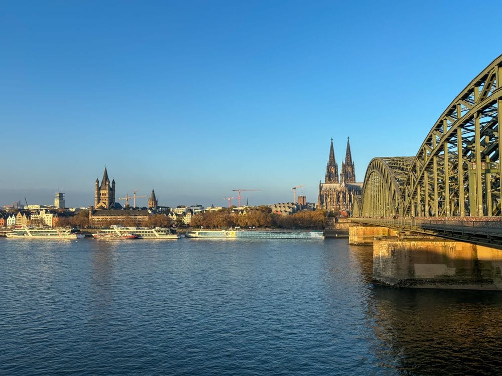 River cruise boats moored on the Rhine below Cologne Cathedral, one of the destinations Mercury Holidays packages as a river cruise