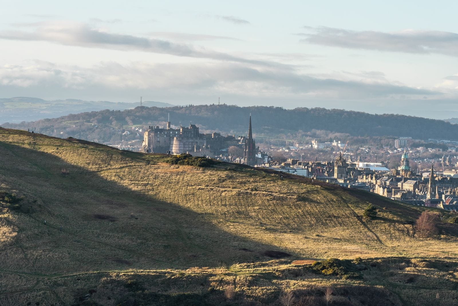 Edinburgh Castle and the Old Town skyline seen from Arthur's Seat, the classic starting point for a Scottish Highlands holiday