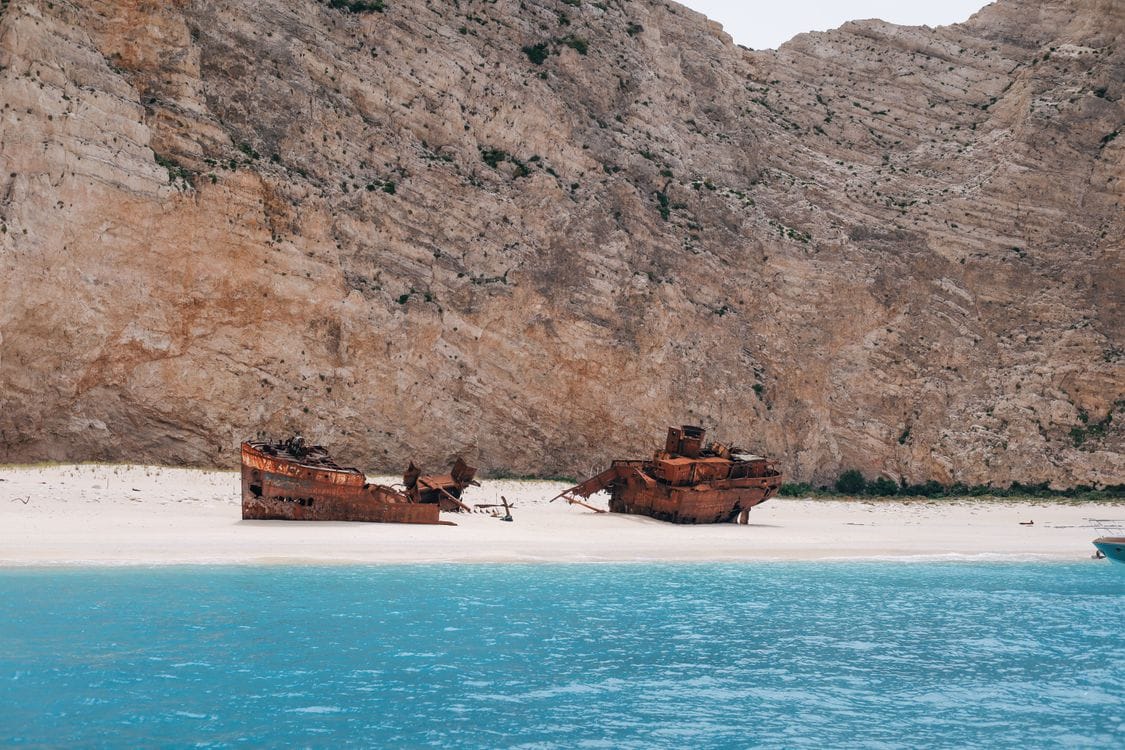 Navagio Shipwreck Beach, Zakynthos, Greece, with rusting wreck on white sand