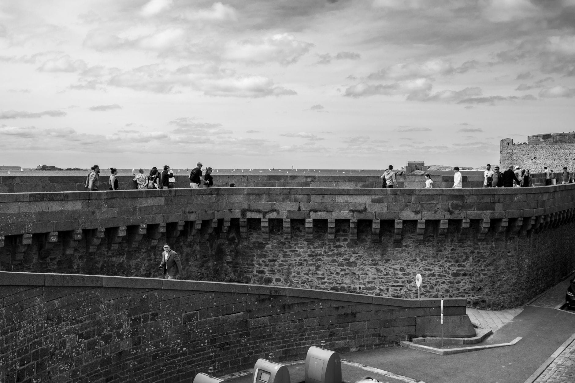Visitors walk the 17th-century ramparts that ring Saint-Malo's walled old town