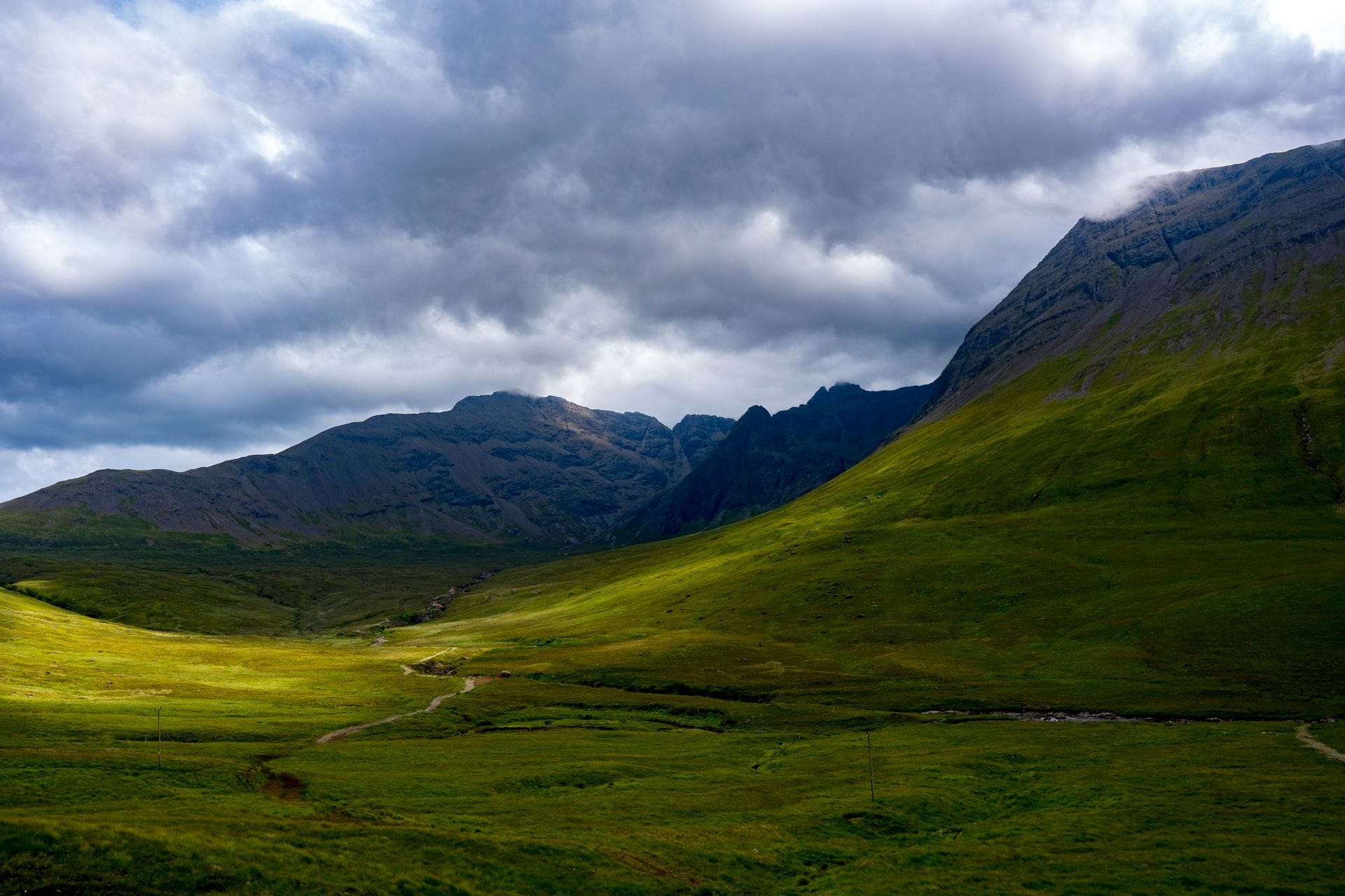 Green hills and mountains in the Scottish Highlands, a top coolcations pick for UK travellers
