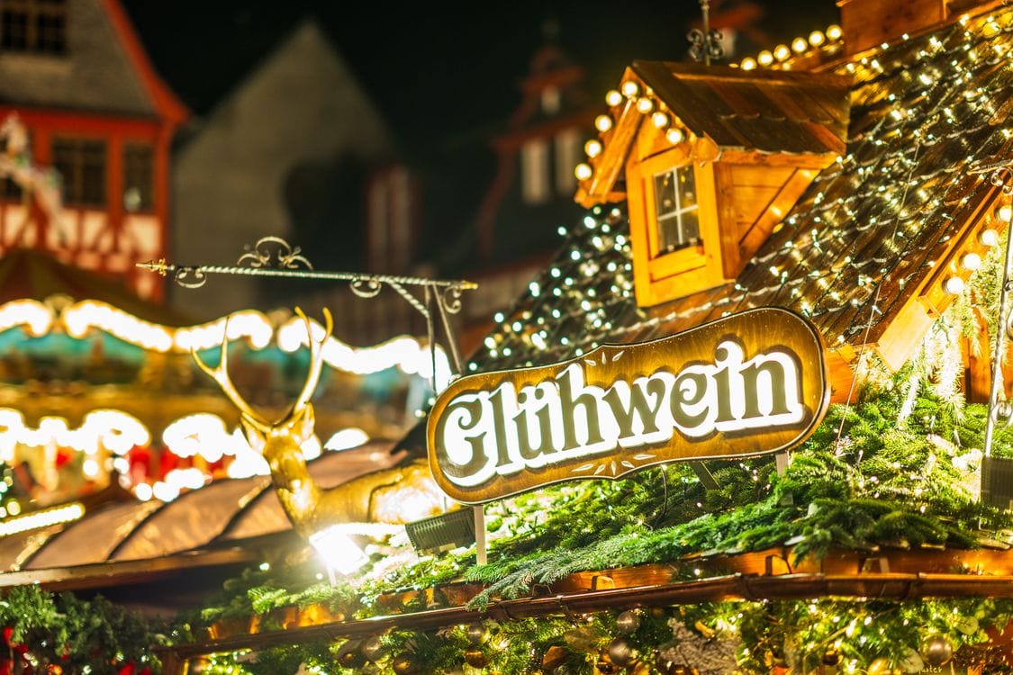 A festively lit mulled wine stall at a Strasbourg Christmas market