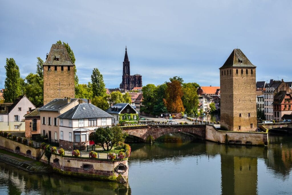 Strasbourg's Ponts Couverts towers on the canal with the cathedral spire behind, a free sight for Strasbourg on a budget
