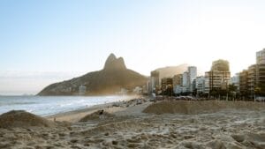 Ipanema Beach in Rio de Janeiro with mountains and city skyline