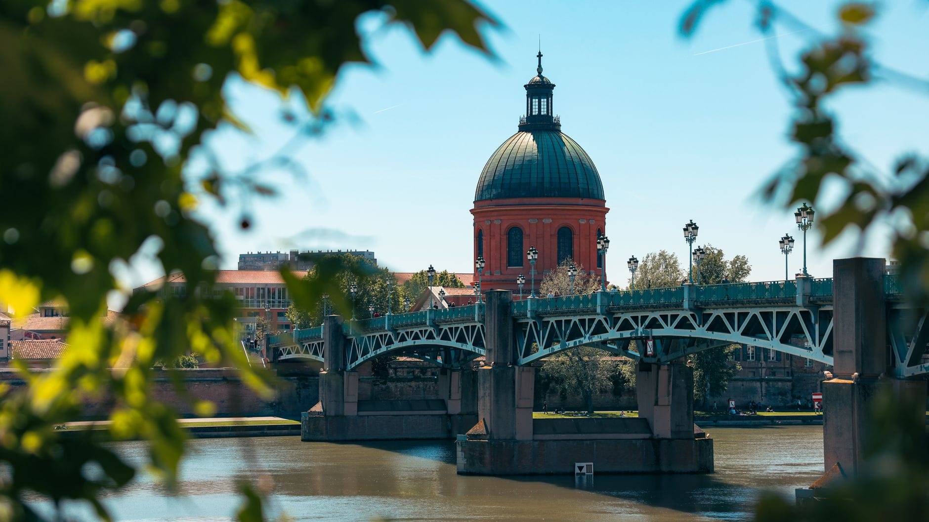 The red dome of the Hopital de la Grave seen across the Garonne from Pont Saint-Pierre in Toulouse