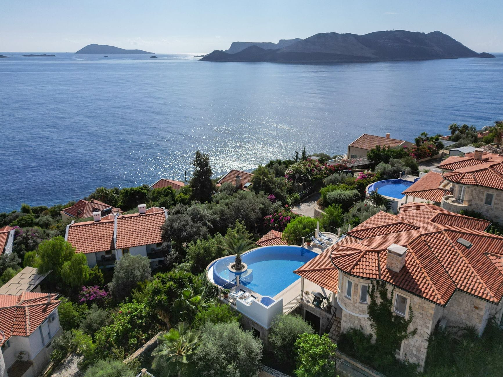 Turkey budget travel: villas with private pools overlooking the Aegean coast near Kalkan