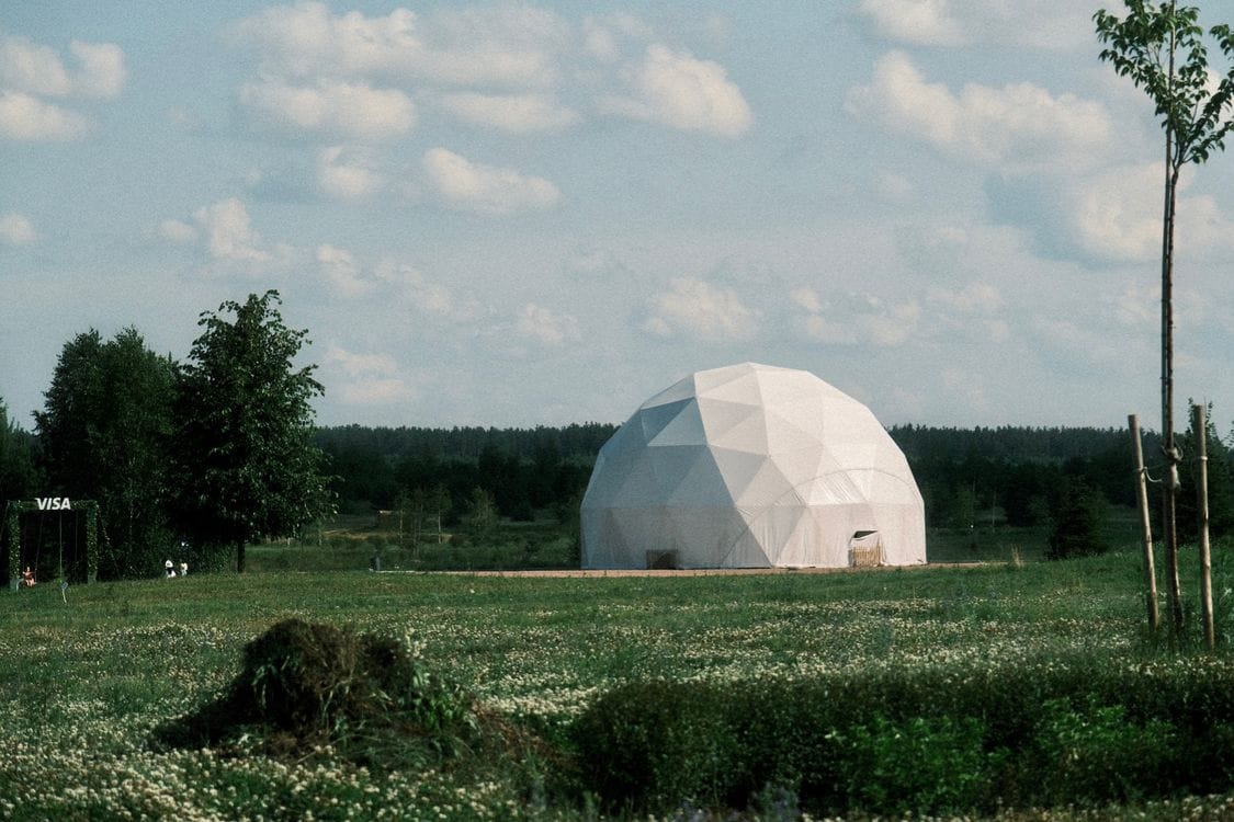 Geodesic dome accommodation on grass in the English countryside