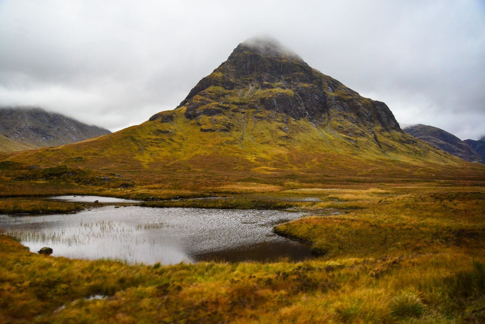 Glen Coe in the Scottish Highlands with autumn colours on the mountainside