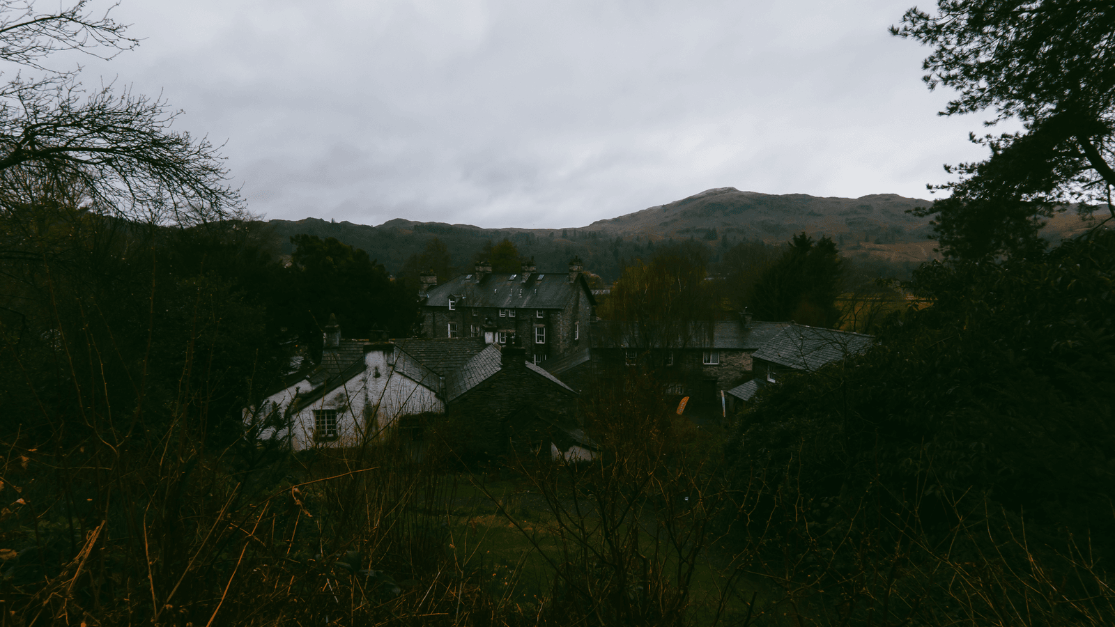 Grasmere village in the Lake District with autumn trees and fells
