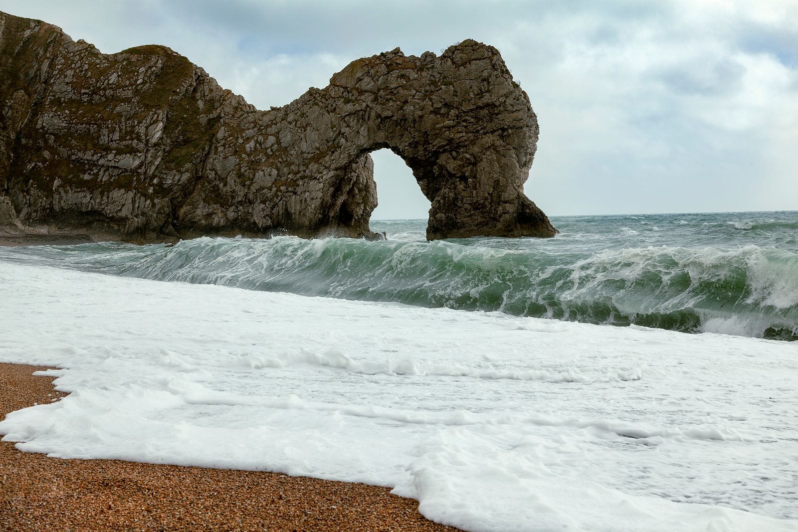UK staycations 2026: Durdle Door on Dorset's Jurassic Coast, one of Britain's most iconic natural landmarks