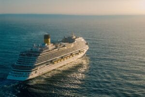 Avanti reviews: a cruise ship sailing across the ocean at sunset