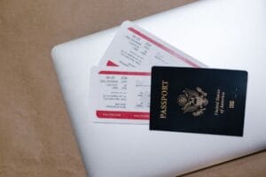 British Airways name change fee: a passport and boarding passes on a laptop, the documents a name correction has to match