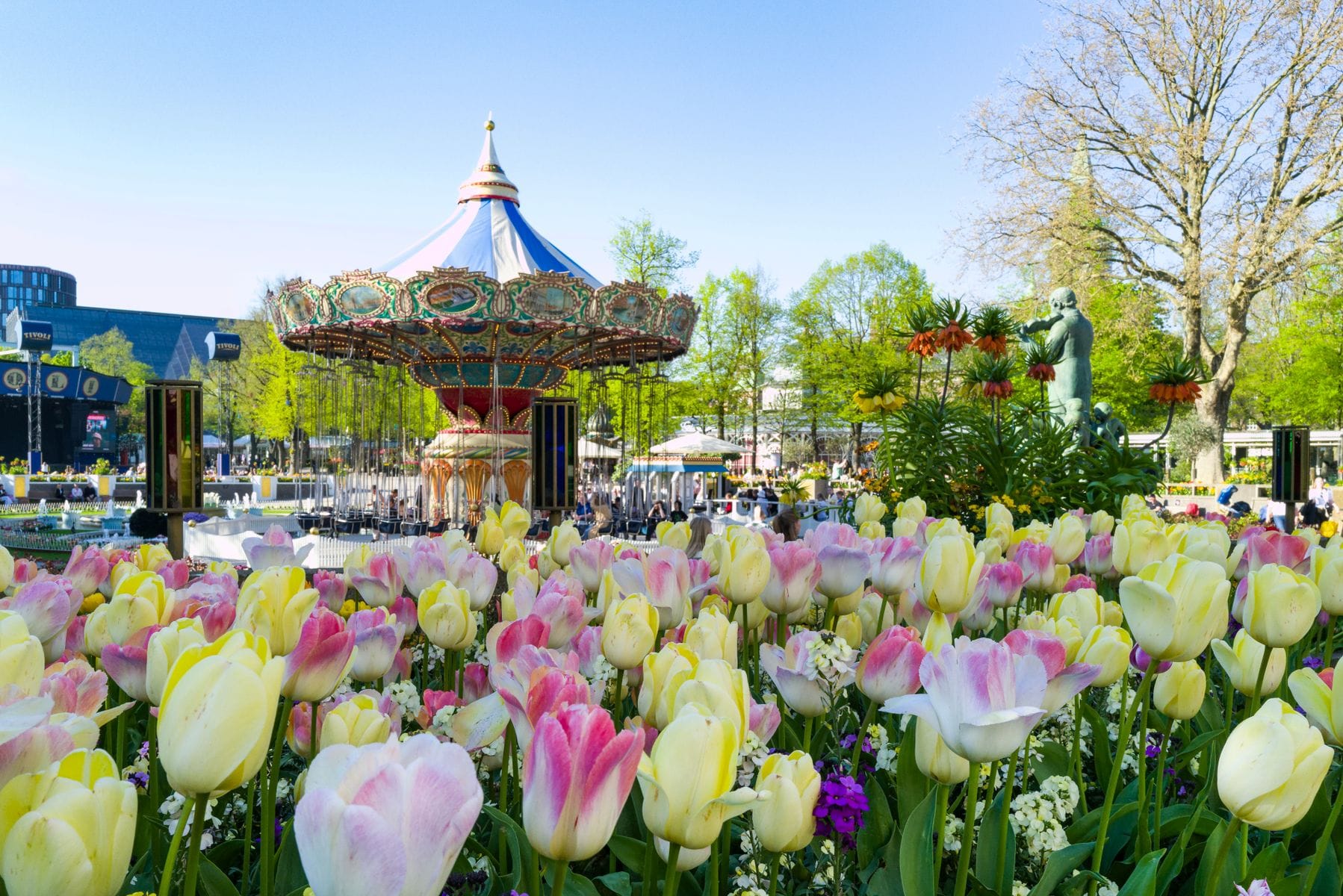 A carousel ride and spring tulips inside Tivoli Gardens, Copenhagen