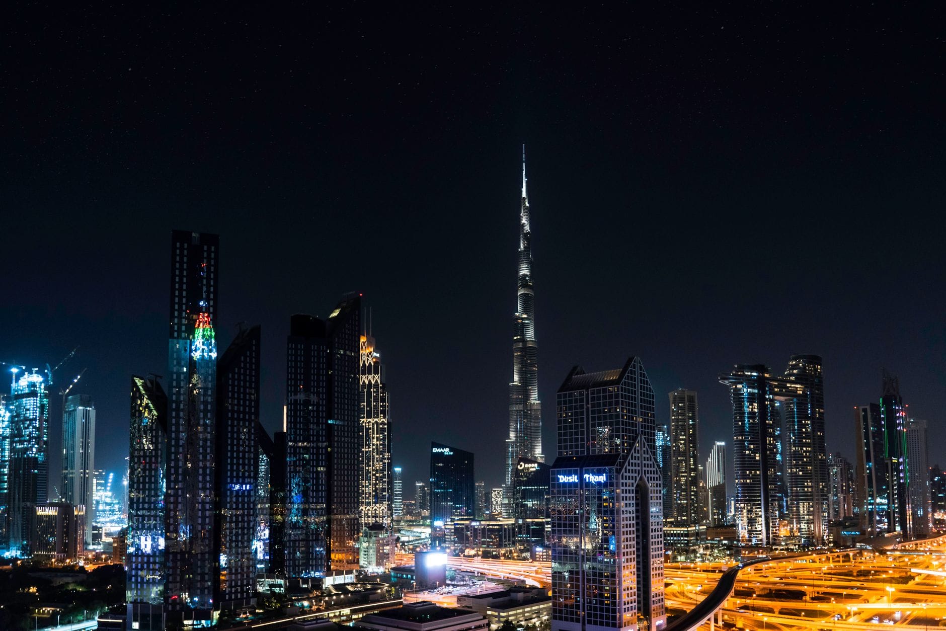 The Burj Khalifa lit up above the Downtown Dubai skyline at night