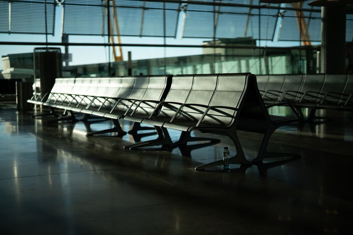 Airport departure lounge, weighing up the easyJet name change fee against a fresh fare