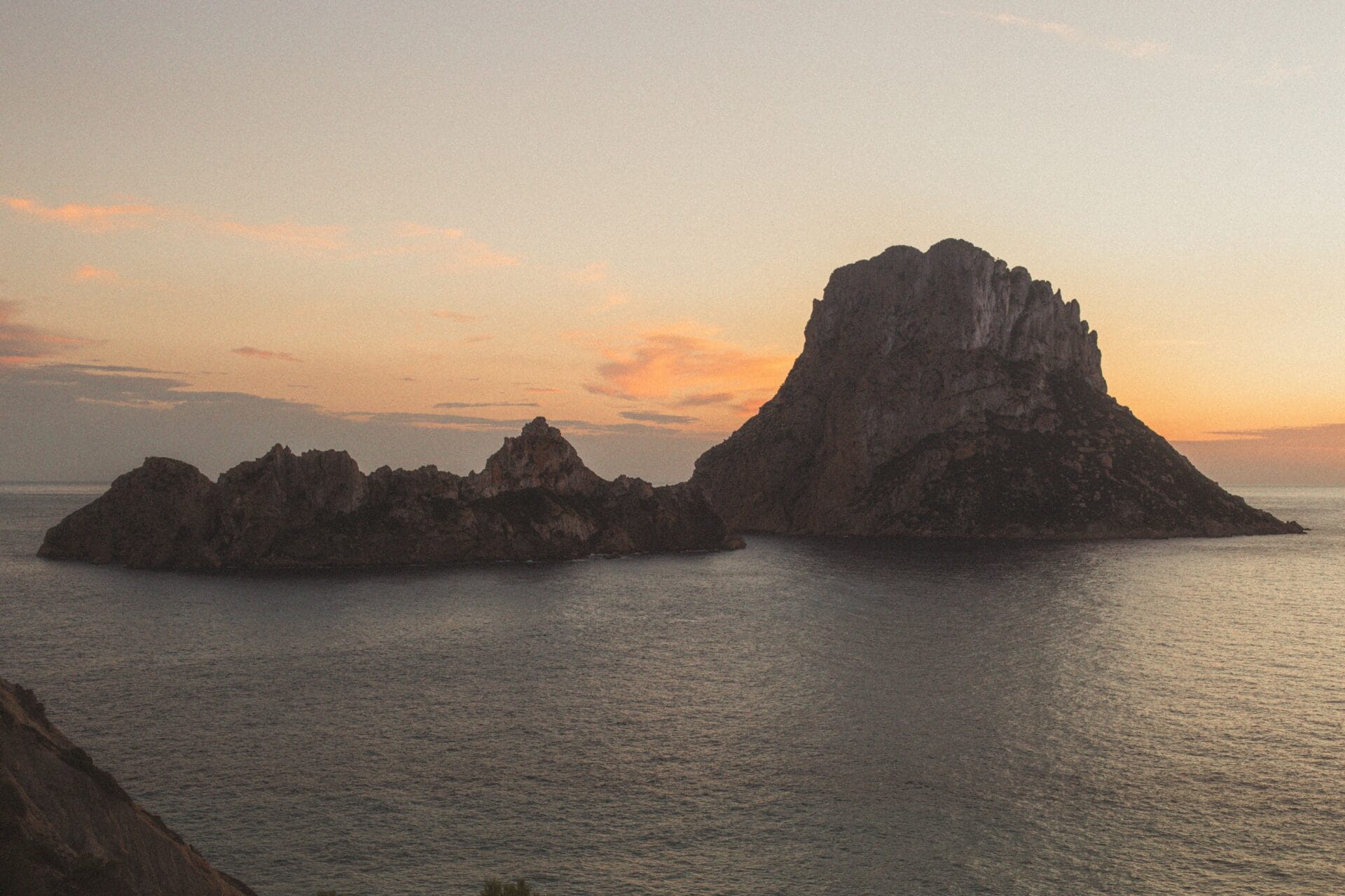 Es Vedrà island off Ibiza's south-west coast, silhouetted at sunset