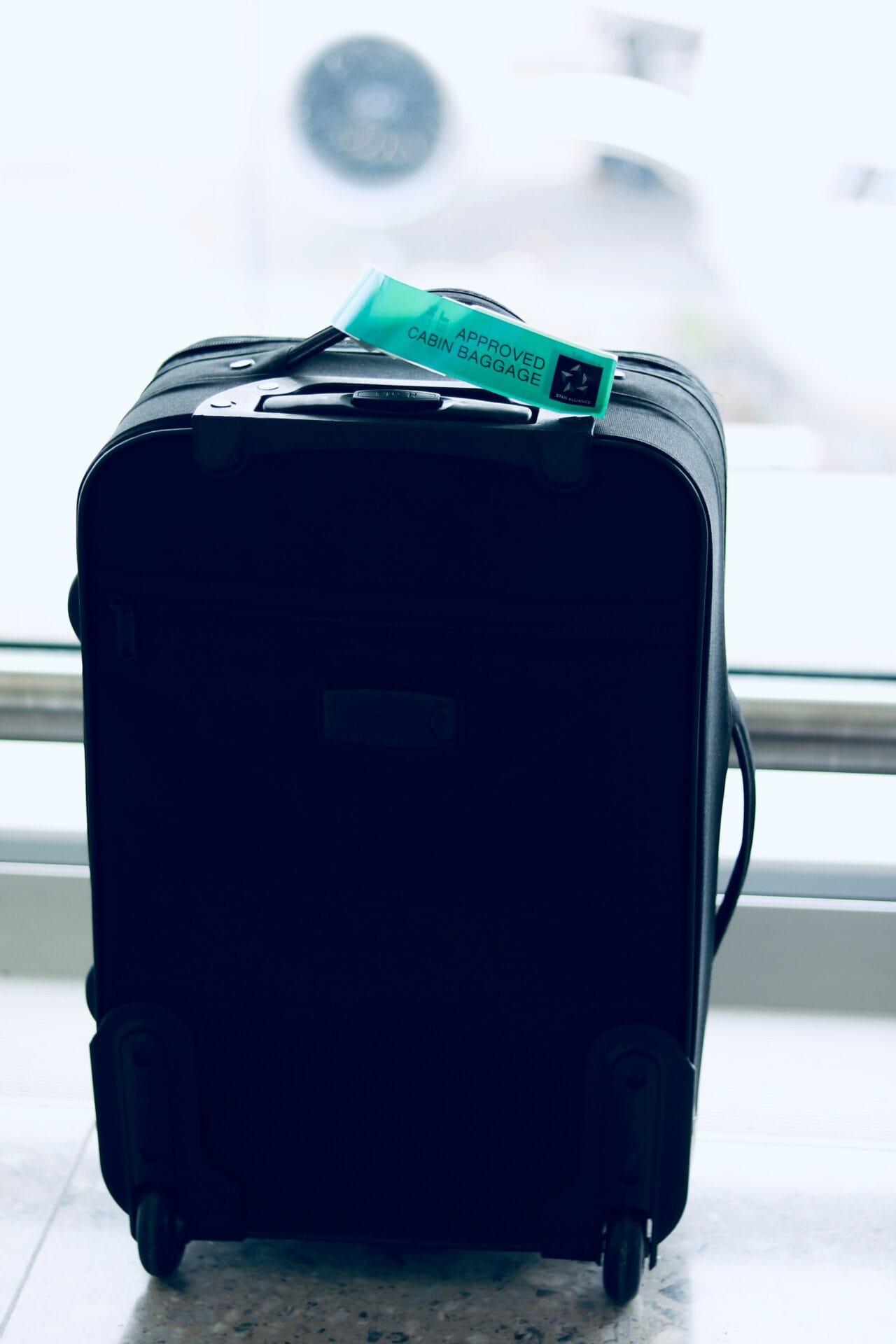 A cabin-approved suitcase in an airport setting, the free 10kg hand luggage allowance included in every Jet2 fare