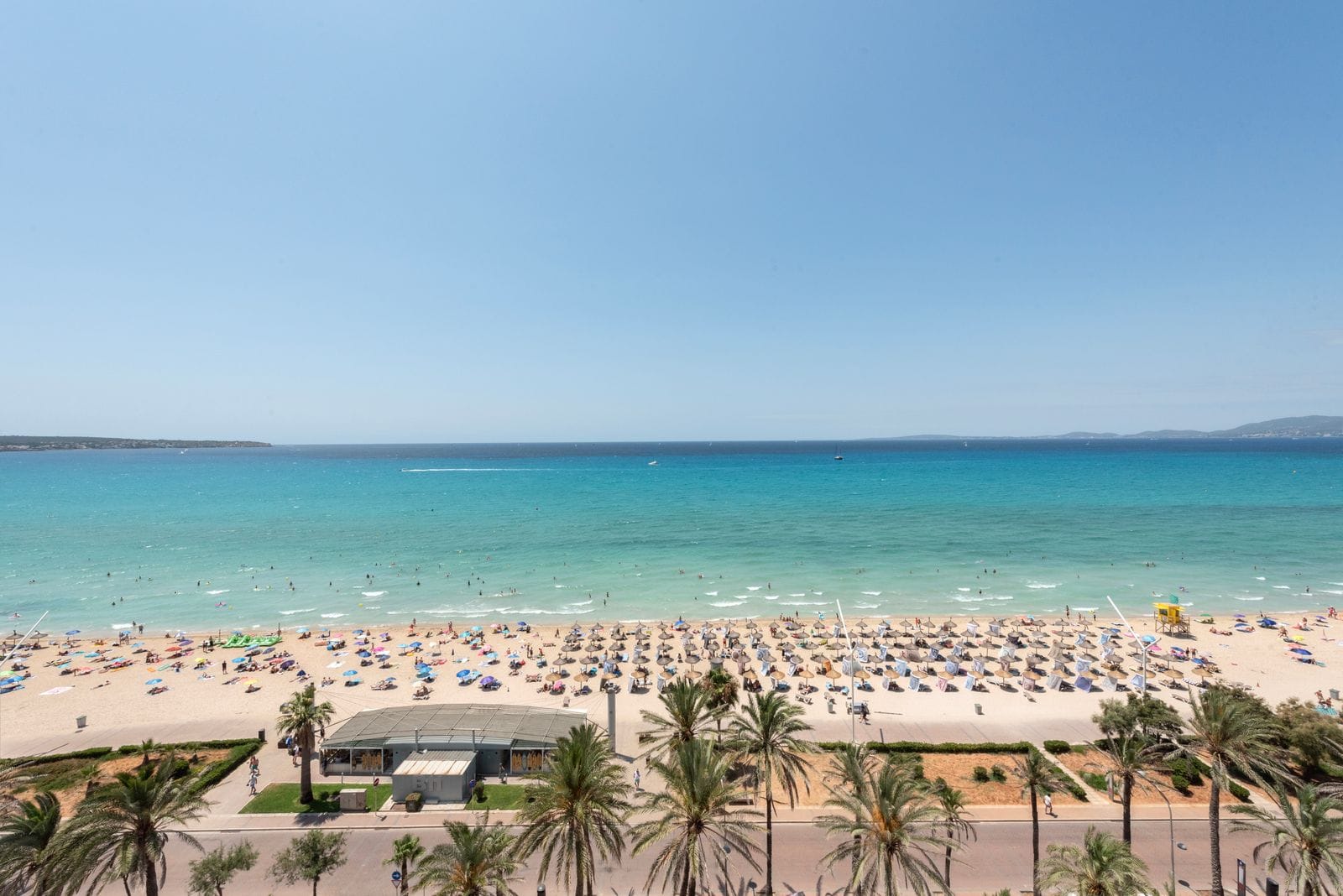 Palma beach with the city and mountains visible along the bay