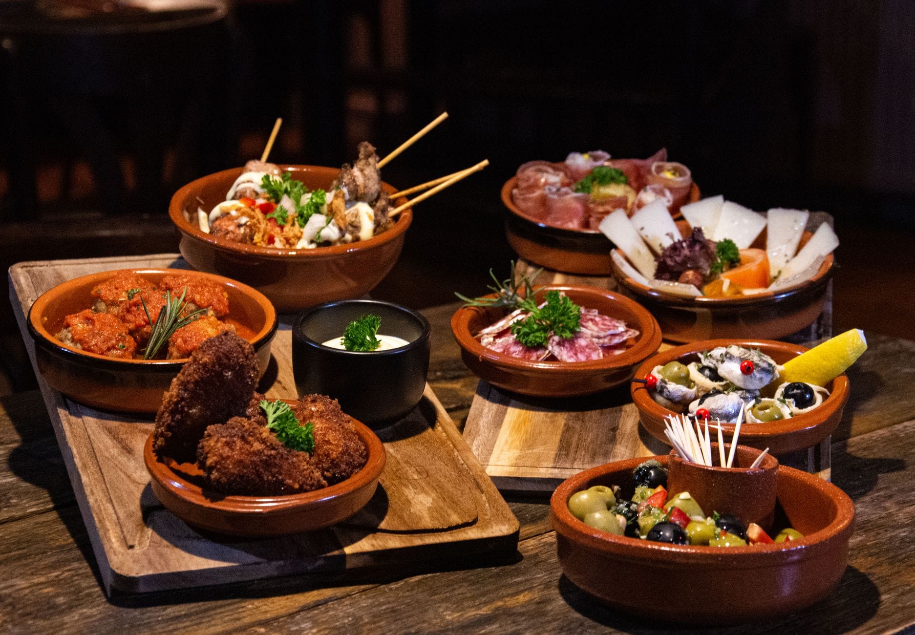 A spread of Spanish tapas dishes typical of Marbella Old Town bars