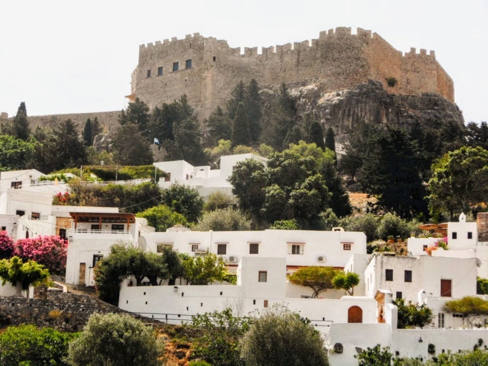 The Acropolis of Lindos on its cliff above the whitewashed houses of Lindos village